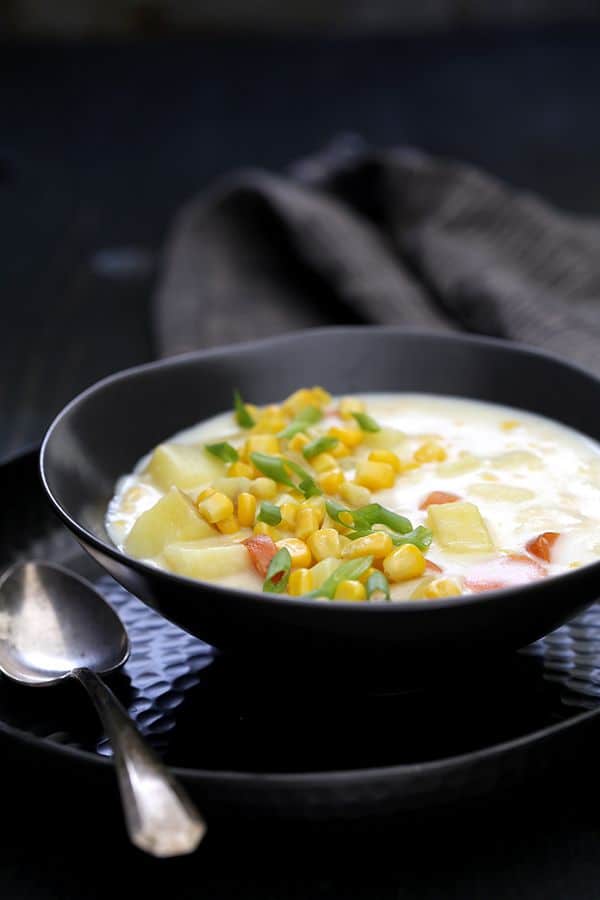 Carrots, potatoes and celery are stirred together with a creamy, comforting rue and corn to create a quick and easy Potato Corn Chowder. Each bowl is garnished with additional corn, green onions and cheddar cheese to provide a contrast in texture that keeps you returning to your bowl for just one bite.