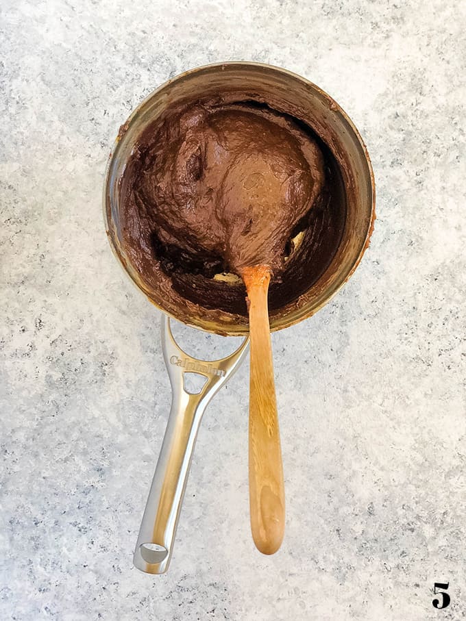 Chocolate Cream Puff dough stirred together in a saucepan.