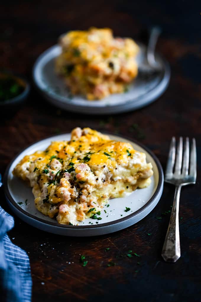 Bridge Brunch Casserole on a white plate with a fork next to it.