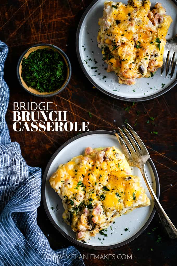 Two plates of Bridge Brunch Casserole with a small bowl of parsley.