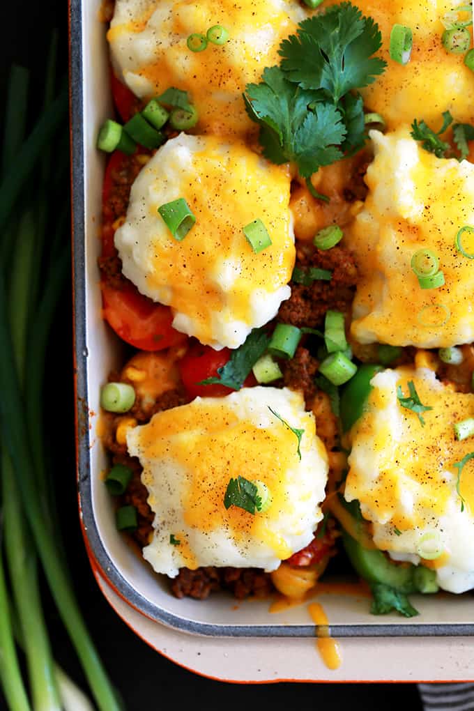 Stuffed peppers in only 30 minutes?  Totally possible!  These Southwest Skillet Stuffed Peppers are part shepherd's pie, part stuffed pepper and seasoned like a taco.  Topped with a fluffy mound of mashed potatoes and melty cheese, you'll have a delicious weeknight dinner on the table in no time.