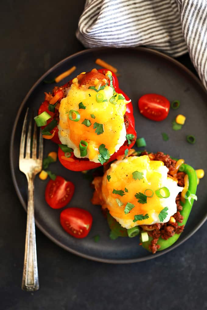 Stuffed peppers in only 30 minutes?  Totally possible!  These Southwest Skillet Stuffed Peppers are part shepherd's pie, part stuffed pepper and seasoned like a taco.  Topped with a fluffy mound of mashed potatoes and melty cheese, you'll have a delicious weeknight dinner on the table in no time.