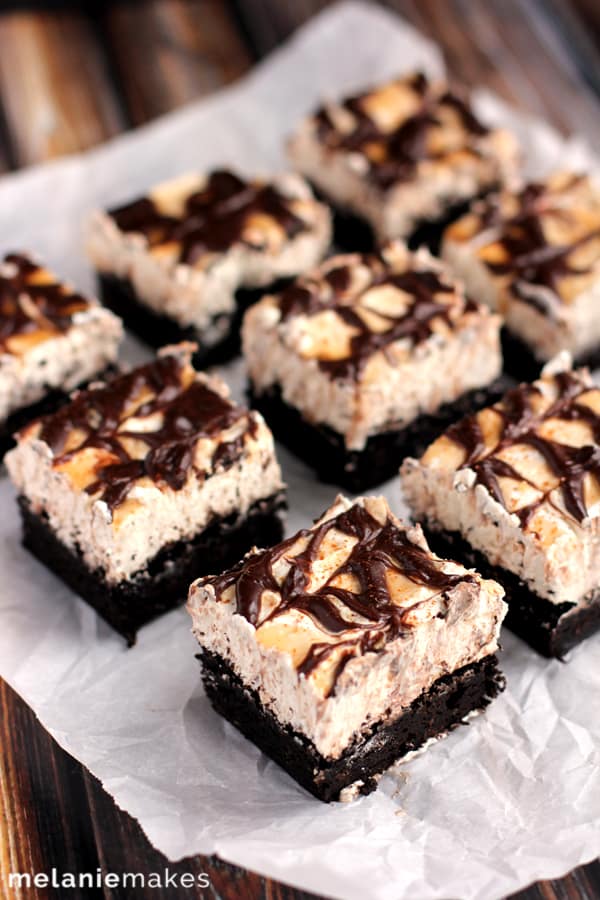 These Snickerdoodle Cheesecake Brownie Bars are the delicious combination of three different desserts. A rich, soft brownie is the base for a cinnamon cheesecake that is then topped with caramel, chocolate ganache and a dusting of cinnamon.