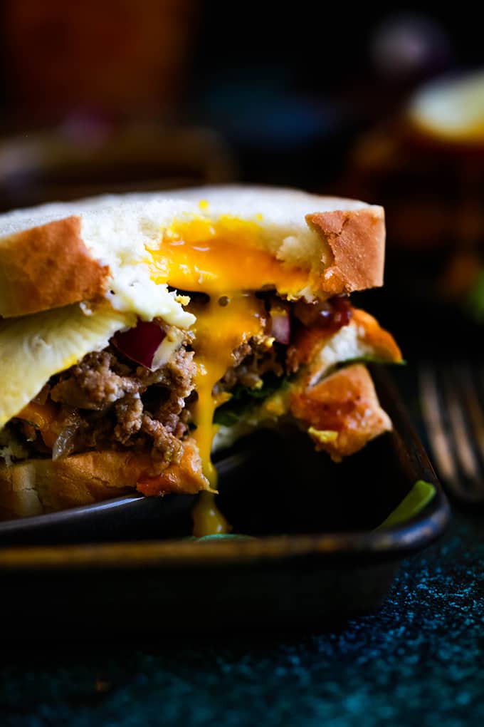 A Grilled Barbecue Bacon Meatloaf Sandwich with a bite removed.