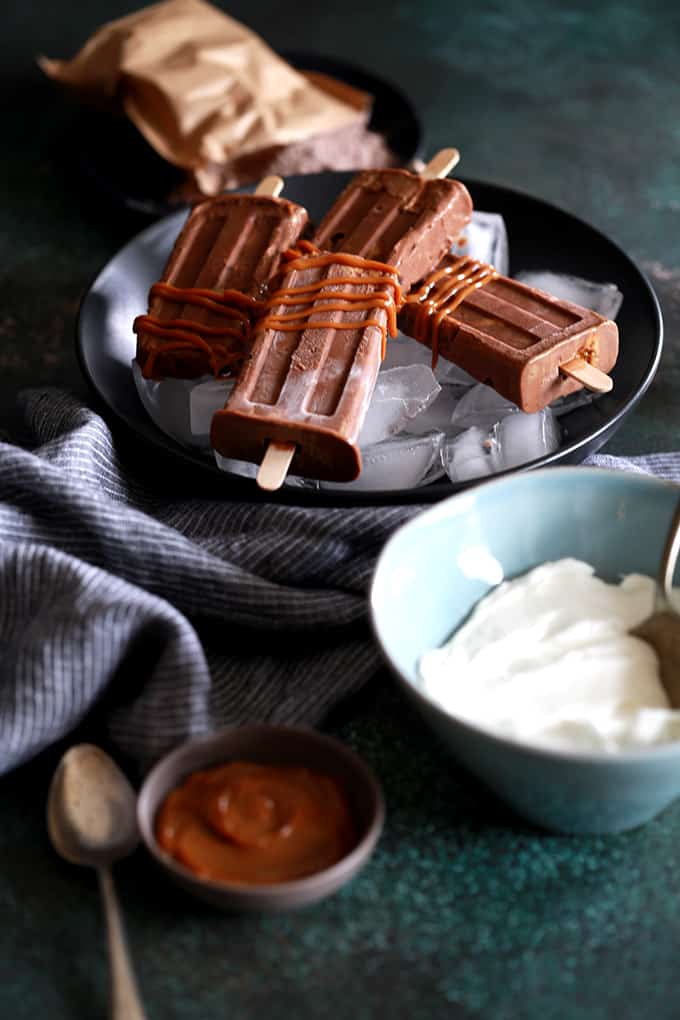 I've revamped my childhood favorite pudding popsicles into these out of this world Dulce de Leche Chocolate Pudding Popsicles!  They couldn't be easier to make and the end result will have you raiding the freezer for more. I've revamped my childhood favorite pudding popsicles into these out of this world Dulce de Leche Chocolate Pudding Popsicles!  They couldn't be easier to make and the end result will have you raiding the freezer for more.