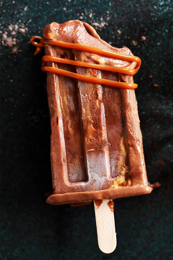 I've revamped my childhood favorite pudding popsicles into these out of this world Dulce de Leche Chocolate Pudding Popsicles!  They couldn't be easier to make and the end result will have you raiding the freezer for more. I've revamped my childhood favorite pudding popsicles into these out of this world Dulce de Leche Chocolate Pudding Popsicles!  They couldn't be easier to make and the end result will have you raiding the freezer for more.