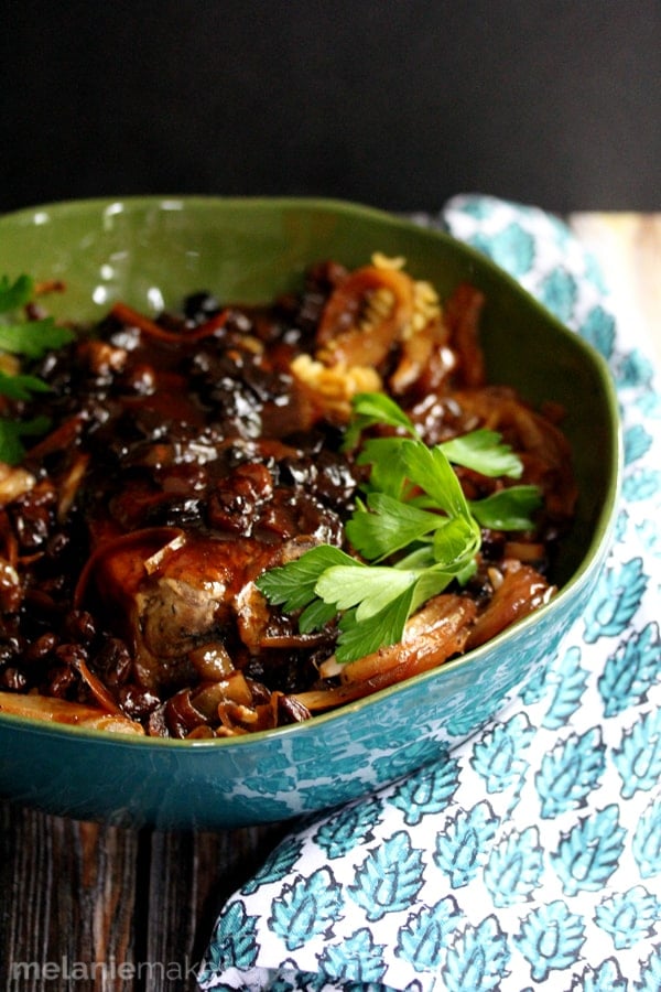 A pork roast seasoned with thyme and bathed in apple juice and nestled into a slow cooker surrounded by sliced onions and dried cherries. A perfect minimal prep, full of flavor dish, this Slow Cooker Pork Roast and Cherries will make your house smell absolutely divine all day as it cooks.