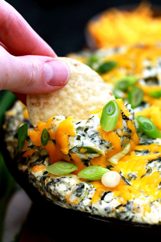 This Creamy Baked Double Cheese and Spinach Dip is the perfect make ahead appetizer.  Cream cheese, yogurt, cheddar cheese, spinach and ranch seasoning are baked to cheesy perfection.  