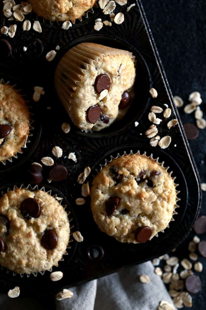 An overhead shot of Oatmeal Chocolate Chip Muffins in a muffin pan.