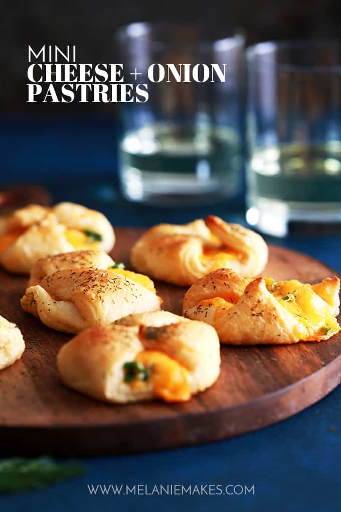These Mini Cheese and Onion Pastries take only four ingredients and 15 minutes to prepare, a definite no-fuss appetizer or snack.  Sharp cheddar cheese and sliced green onion are gathered in the center of a dill dusted, flaky pastry bundle.