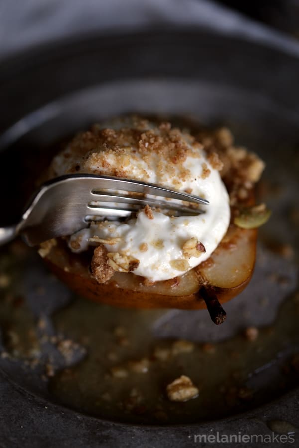 These Granola Streusel Baked Pears couldn't be easier to make and make a great breakfast treat or even a fabulous - almost healthy! - dessert. Gorgeous D'Anjou pears are stuffed with a delicious cinnamon granola streusel and baked in an apple juice bath until fork tender. A dollop of Greek yogurt is placed on top before being sprinkled with yet more struesel. 