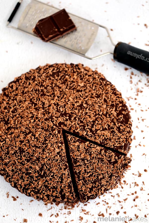 A brownie batter cookie crust is filled with a luscious chocolate ganache and the entire tart is covered in chocolate shavings. Rich and decadent, this Brownie Batter Chocolate Tart is the stuff that dreams are made of! 