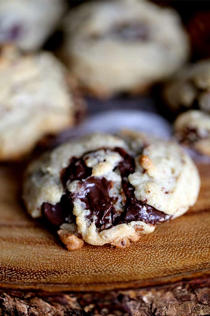 These Dark Chocolate Covered Potato Chip Cookies are the perfect sweet and salty combination.  Dark chocolate covered potato chips, dark chocolate chips and pecans bespeckle this delicious cookie base.  Warm from the oven, the chocolate puddles in each crevice and at room temperature, the potato chips lend their crunch to this sweet treat.  