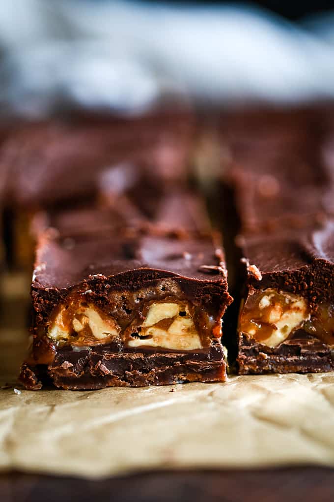 The side view of two Easy Snickers Brownies.