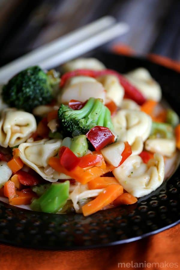Taking shortcuts in the kitchen doesn't have to mean a boring meal!  This four ingredient Pepper and Garlic Tortellini Stir Fry comes together in just 20 minutes and is guaranteed to make hungry bellies happy. 