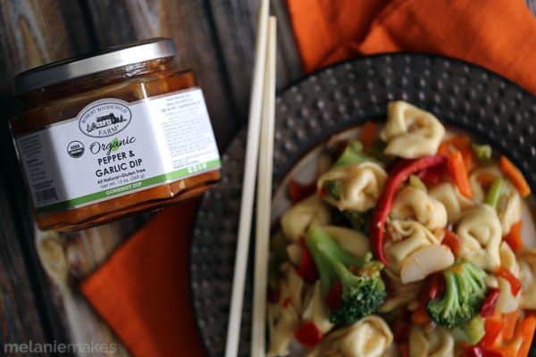Taking shortcuts in the kitchen doesn't have to mean a boring meal!  This four ingredient Pepper and Garlic Tortellini Stir Fry comes together in just 20 minutes and is guaranteed to make hungry bellies happy. 