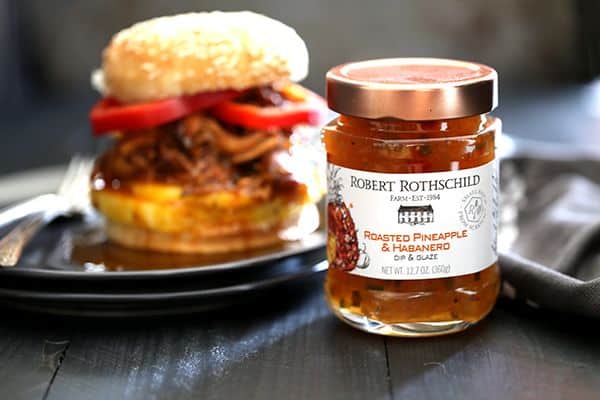 It takes just five minutes and three ingredients to create this sweet and spicy Pineapple and Habanero Slow Cooker Pulled Pork. It's then piled high on a toasted bun and sandwiched between slices of red pepper and fresh pineapple to create the messiest, most delicious pork sandwich that has ever met your lips. 