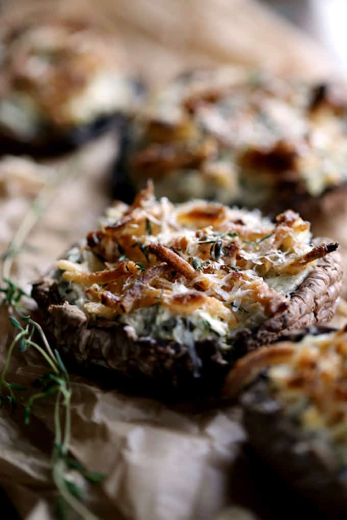 These five ingredient Artichoke and Spinach Stuffed Portobellos take just 10 minutes to prepare.  Meaty portobello mushroom caps are stuffed with artichoke spinach dip before being topped with french fried onions, fresh thyme and Parmesan cheese.
