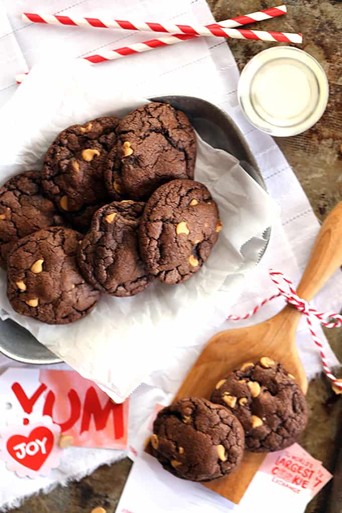 Decadent, almost brownie like, chocolate cookies are studded with peanut butter chips before being stuffed with a rich, cheesecake filling.  These Cheesecake Stuffed Chocolate Peanut Butter Cookies are sure to disappear from your cookie jar at record speed.
