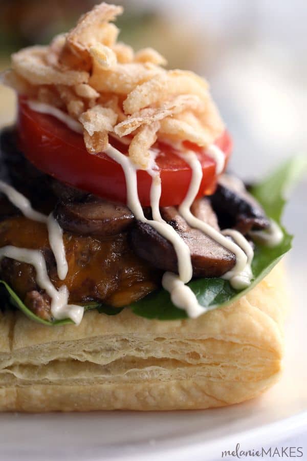 Sure, these Beef Wellington Burgers aren't meant to be handheld but they do welcome a side of fries with open arms! A puff pastry square is layered with salad greens and cheeseburger spiked with horseradish and Dijon mustard before being topped with mushrooms, tomato, french fried onions and a horseradish Dijion mayonnaise.
