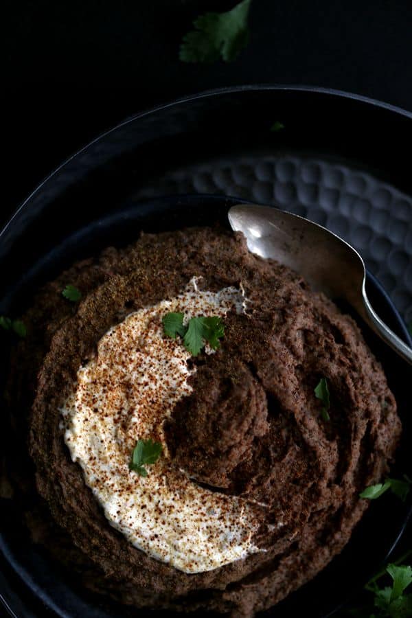 The award for easiest appetizer goes to this Sweet and Spicy Black Bean Hummus. Bid farewell to chickpeas as this hummus gets it's gorgeous earthy color and flavor from pantry staple black beans. All of the ingredients take a whirl in a the bowl of a food processor and emerge as a smooth and creamy hummus ready to enjoy in just 10 minutes.