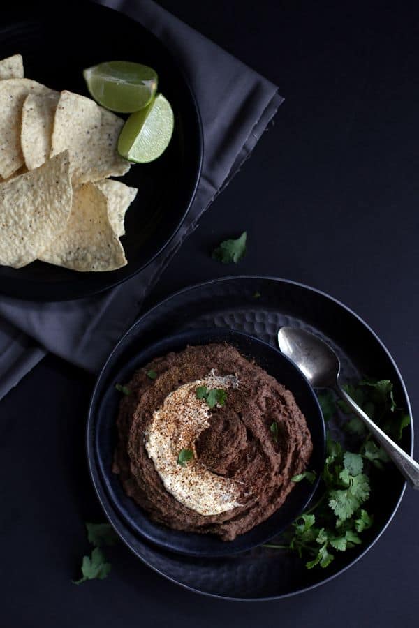 The award for easiest appetizer goes to this Sweet and Spicy Black Bean Hummus. Bid farewell to chickpeas as this hummus gets it's gorgeous earthy color and flavor from pantry staple black beans. All of the ingredients take a whirl in a the bowl of a food processor and emerge as a smooth and creamy hummus ready to enjoy in just 10 minutes.