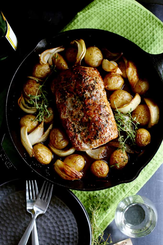This Thyme Crusted Pork Roast with Soy Caramel Sauce is dressed to impress!  A crust of pepper, salt and thyme envelopes the pork that is then roasted alongside baby Yukon Gold potatoes and onion wedges.  A waterfall of soy caramel sauce is then poured over everything before it's returned to the oven to finish roasting.