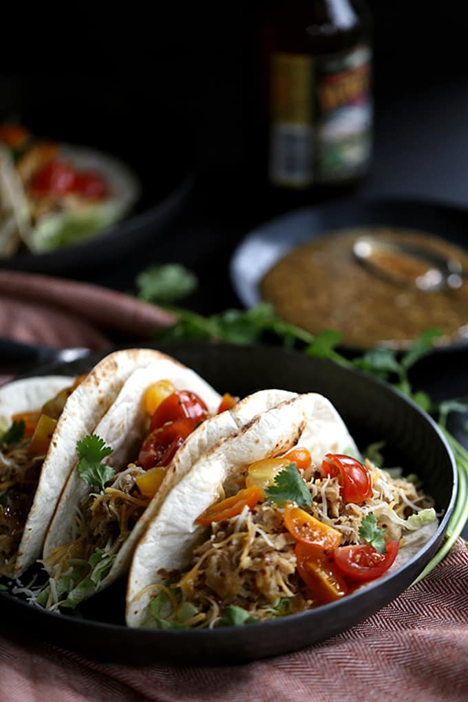 These Slow Cooker Honey Mustard Pork Tacos with Candied Bacon couldn't be easier, yet more flavorful.  Just four ingredients are added to the slow cooker and the sweet and tangy pork that emerges is stuffed into tortillas with candied bacon, lettuce, cheese and tomatoes.  Your new favorite taco awaits!