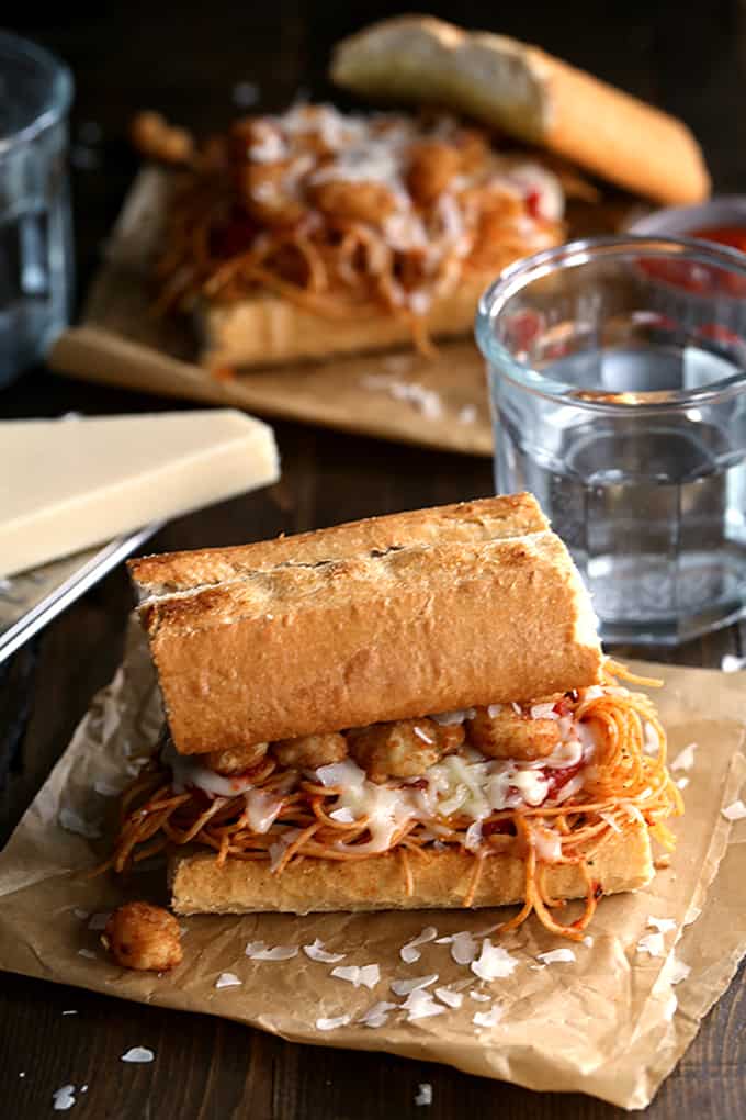 These six ingredient Shrimp Parmesan Sandwiches take just 10 minutes to prepare.  Spaghetti with marinara sauce, popcorn shrimp and mozzarella and Parmesan cheese are sandwiched between two pieces of crusty garlic bread - the perfect meatless meal during Lent!