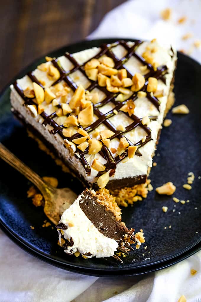 A fork with a bite removed from a slice of Almost No Bake Drumstick Cheesecake.