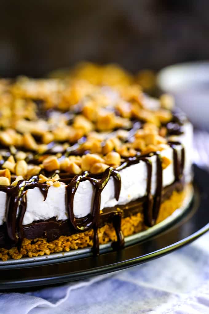 Chocolate drips down the side of an Almost No Bake Drumstick Cheesecake.