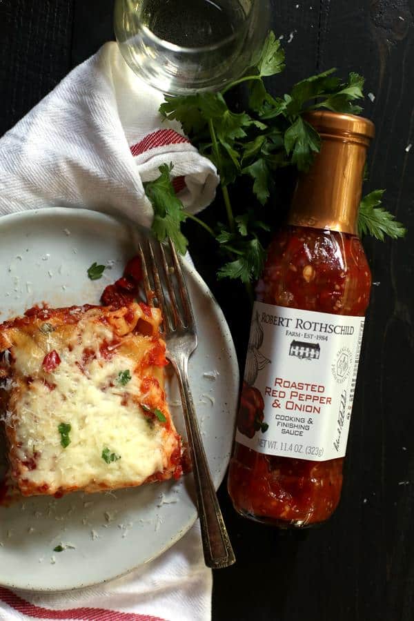 Looking for a new favorite comfort food? Look no further than my Roasted Red Pepper Puttanesca Lasagna Rolls. Single serving lasagna rolls are filled with vegetables, olives, capers and cheese before being bathed in a roasted red pepper sauce and blanketed by two additional layers of cheese and emerge from the oven a pan of melty, bubbly goodness.