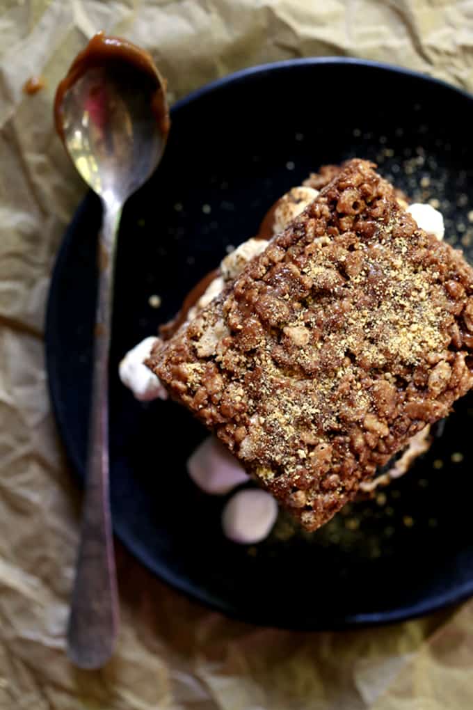 These S'mores Stuffed Chocolate Krispie Treats are the perfect mash-up of two favorite summertime sweets. Thick and chewy chocolate marshmallow treat bars are split in half before being lacquered with chocolate and torched mini marshmallows. The other half of the Rice Krispies treat is plunked on top and then they're sprinkled with a shower of graham cracker crumbs to create the ultimate summer dessert sandwich. These S'mores Stuffed Chocolate Krispie Treats are the perfect mash-up of two favorite summertime sweets. Thick and chewy chocolate marshmallow treat bars are split in half before being lacquered with chocolate and torched mini marshmallows. The other half of the Rice Krispies treat is plunked on top and then they're sprinkled with a shower of graham cracker crumbs to create the ultimate summer dessert sandwich.