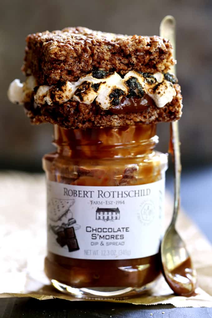 These S'mores Stuffed Chocolate Krispie Treats are the perfect mash-up of two favorite summertime sweets. Thick and chewy chocolate marshmallow treat bars are split in half before being lacquered with chocolate and torched mini marshmallows. The other half of the Rice Krispies treat is plunked on top and then they're sprinkled with a shower of graham cracker crumbs to create the ultimate summer dessert sandwich. These S'mores Stuffed Chocolate Krispie Treats are the perfect mash-up of two favorite summertime sweets. Thick and chewy chocolate marshmallow treat bars are split in half before being lacquered with chocolate and torched mini marshmallows. The other half of the Rice Krispies treat is plunked on top and then they're sprinkled with a shower of graham cracker crumbs to create the ultimate summer dessert sandwich.