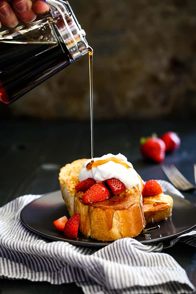 Maple syrup is drizzled onto slices of Vanilla French Toast.