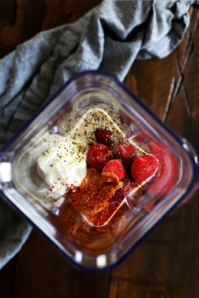 This four ingredient Strawberry Almond Smoothie takes just five minutes or less to prepare. Frozen strawberries, Greek yogurt, almond milk and almond butter whirl together to create this smooth and luxurious treat that's not only perfect for breakfast but also for lunch or a post-workout treat.