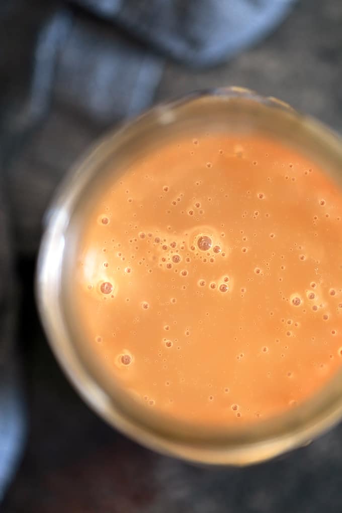 An overhead view of a jar of dulce de leche.