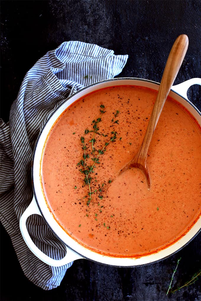 This ten ingredientÂ Creamy Tomato Bacon Soup not only tastes amazing, but it also uses common ingredients already in your pantry and fridge. Â Diced onions, bacon and garlic take a swim in melted butter before being joined with diced tomatoes, chicken broth and herbs. Â An immersion blender makes quick work of making everything a near smooth consistency before it's all bathed in a shower of heavy cream.