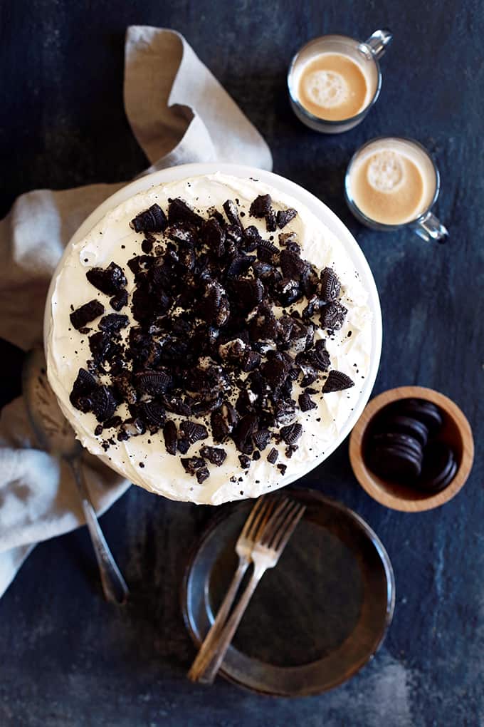 This Coffee Cookies and Cream Cheesecake Brownie Cake is like enjoying five of your favorite desserts all at once. A brownie base is topped with a mocha infused cheesecake studded with Oreos before being topped by a cloud of whipped topping and even more crushed cookies. Basically each and every bite is like pure and absolute heaven. This Coffee Cookies and Cream Cheesecake Brownie Cake is like enjoying five of your favorite desserts all at once. A brownie base is topped with a mocha infused cheesecake studded with Oreos before being topped by a cloud of whipped topping and even more crushed cookies. Basically each and every bite is like pure and absolute heaven.