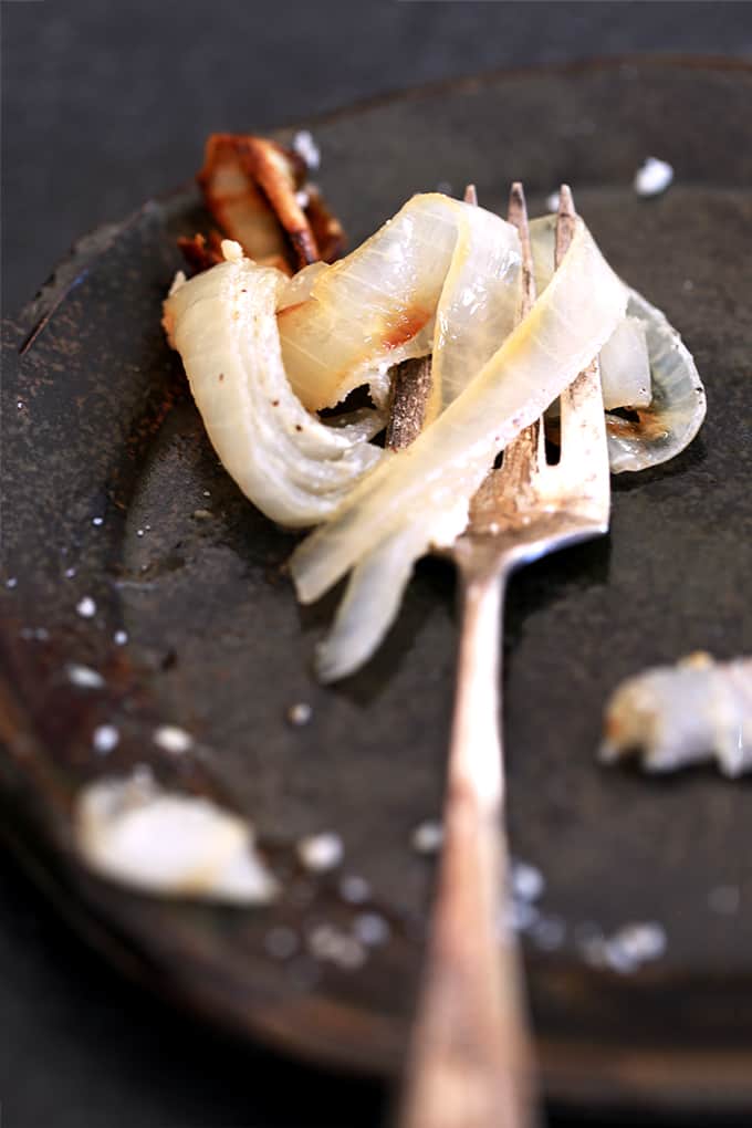 These five ingredient Oven Roasted Sour Cream and Parmesan Onions are an easy side dish that is perfect for any night of the week and equally special at a holiday dinner table.  Onion rounds are drizzled in olive oil and oven roasted before being slathered in a sour cream and Parmesan cheese sauce and baked until golden brown.