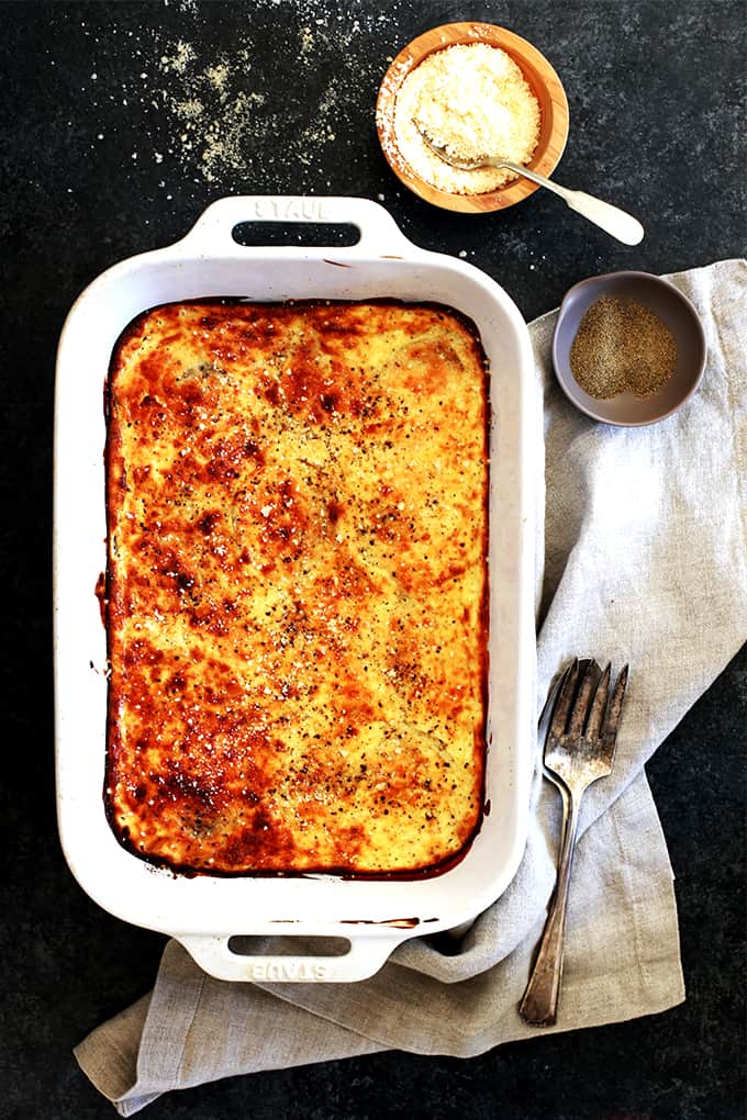 These five ingredient Oven Roasted Sour Cream and Parmesan Onions are an easy side dish that is perfect for any night of the week and equally special at a holiday dinner table.  Onion rounds are drizzled in olive oil and oven roasted before being slathered in a sour cream and Parmesan cheese sauce and baked until golden brown.