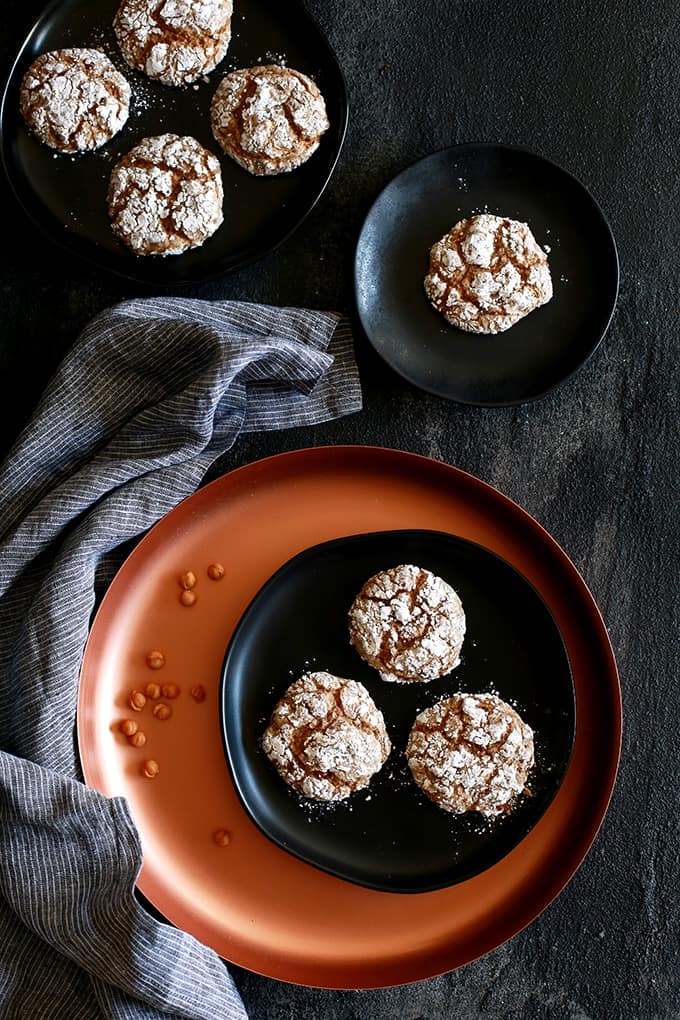 These six ingredient Caramel Pumpkin Spice Crinkle Cookies take just 20 minutes from you stirring the batter in a mixing bowl to you enjoying your first heavenly bite. A spice cake mix is studded with caramel bits and their flavor is taken to the next level with pumpkin spice extract. The perfect holiday flavor combination and one that is sure to be welcomed with open arms at cookie exchanges! These six ingredient Caramel Pumpkin Spice Crinkle Cookies take just 20 minutes from you stirring the batter in a mixing bowl to you enjoying your first heavenly bite. A spice cake mix is studded with caramel bits and their flavor is taken to the next level with pumpkin spice extract. The perfect holiday flavor combination and one that is sure to be welcomed with open arms at cookie exchanges!