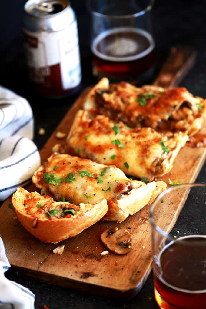 These Beef Stroganoff French Bread Toasts are perfect as a hearty appetizer for holiday get togethers or gameday or even as a family pleasing main dish. Crispy, crunchy French bread halves are loaded with a homemade beef stroganoff mixture that's then piled high with a mountain of melty, bubbly cheese. In short, it's the true definition of comfort food that's guaranteed to please anyone that's lucky enough to get a nibble. These Beef Stroganoff French Bread Toasts are perfect as a hearty appetizer for holiday get togethers or gameday or even as a family pleasing main dish. Crispy, crunchy French bread halves are loaded with a homemade beef stroganoff mixture that's then piled high with a mountain of melty, bubbly cheese. In short, it's the true definition of comfort food that's guaranteed to please anyone that's lucky enough to get a nibble.