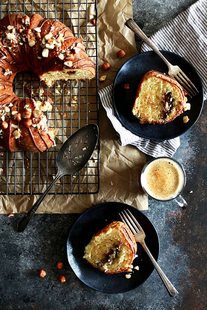 An entire cup of sour cream in this Nutella Sour Cream Coffee Cake insures a tender end result.  Not only does this cake feature a tunnel of Nutella and chopped hazelnuts throughout the inside of the cake, but the finished cake is also garnished with drizzled Nutella and more chopped hazelnuts.  In other words, it's heaven in coffee cake form.   
