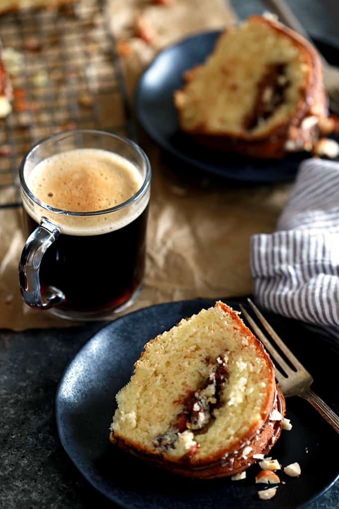 An entire cup of sour cream in this Nutella Sour Cream Coffee Cake insures a tender end result.  Not only does this cake feature a tunnel of Nutella and chopped hazelnuts throughout the inside of the cake, but the finished cake is also garnished with drizzled Nutella and more chopped hazelnuts.  In other words, it's heaven in coffee cake form.   