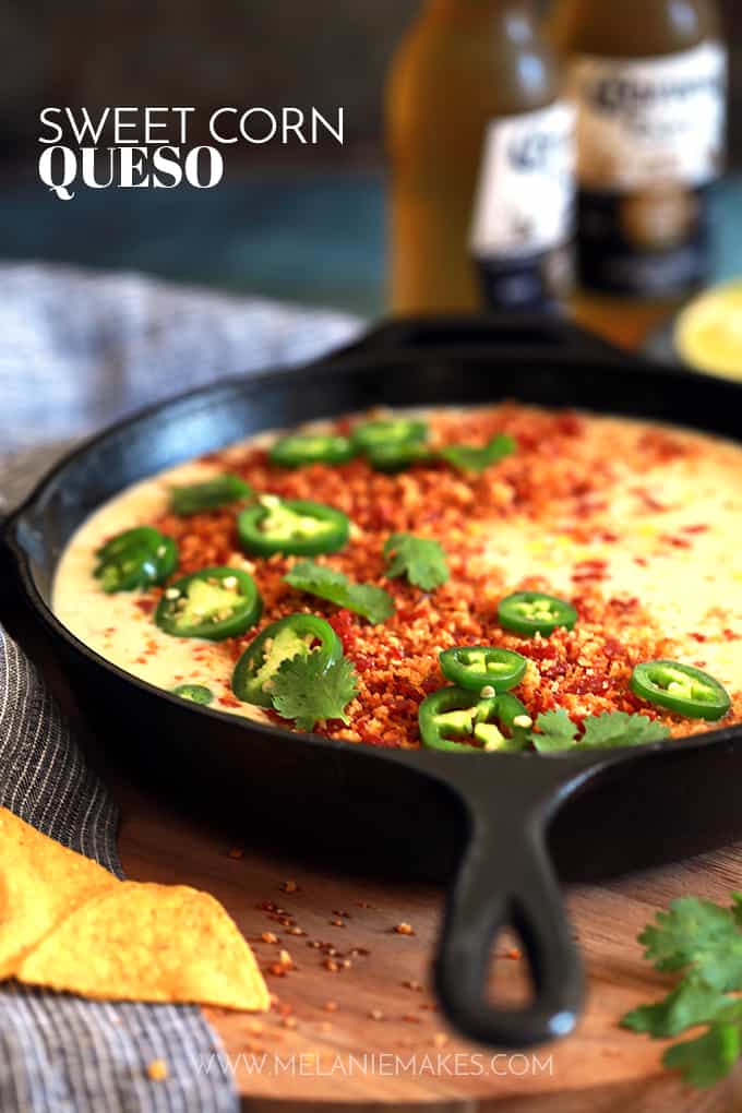 This Sweet Corn Queso with Pepperoni Crumbs literally comes together by just stirring ingredients together with a spoon in a cast iron skillet.  Red onion, garlic, jalapeño and corn are stirred into Monterey Jack cheese to create this incredible queso that's garnished with the most insanely delicious pepperoni crumbs, cilantro and jalapeños.