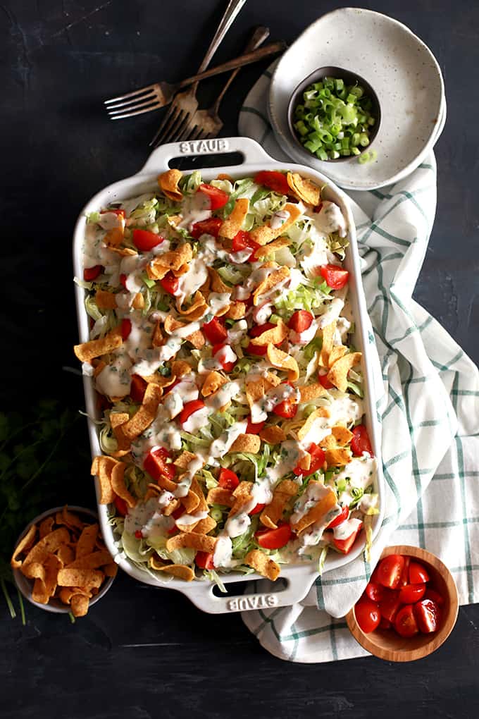 What makes my Taco Bubble Pizza a dinner favorite?  Topped with all the usual taco suspects - ground beef, taco sauce, shredded lettuce, tomatoes, green onions - there's also two toppings which make my Taco Bubble Pizza stand out from the crowd.  You'll no doubt love the crunch of corn chips and homemade chipotle yogurt sauce on this mashup recipe.